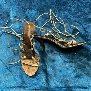 Sandals by Glamour Original! Lace up/wrap around the leg. Gold color!